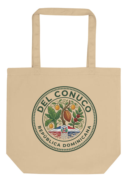 Natural organic cotton eco tote bag with Del Conuco Heritage Edition brand seal featuring cacao pod, banana leaves, coffee cherries, chinola vines, and Dominican flag at the base